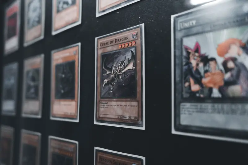 Rows of framed trading cards on a dark display wall