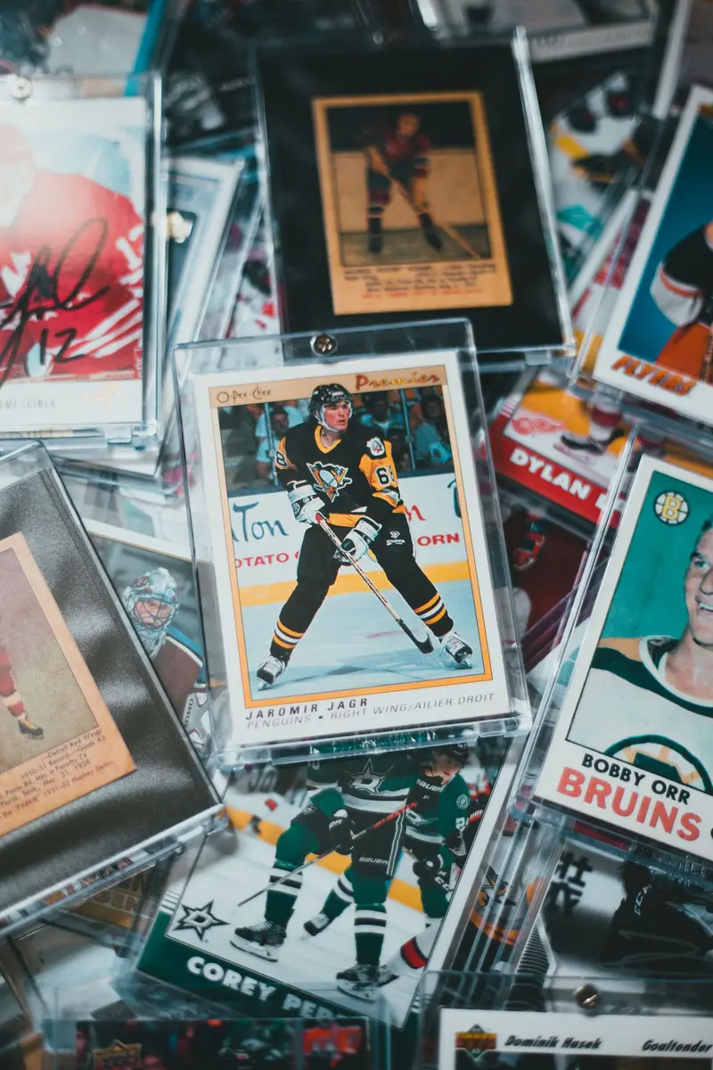 A pile of vintage hockey cards, several in rigid holders
